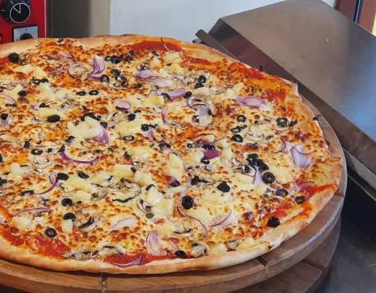This Takeaway Serves Yorkshire’s Biggest Pizza & The Slices Are Bigger Than Your Head