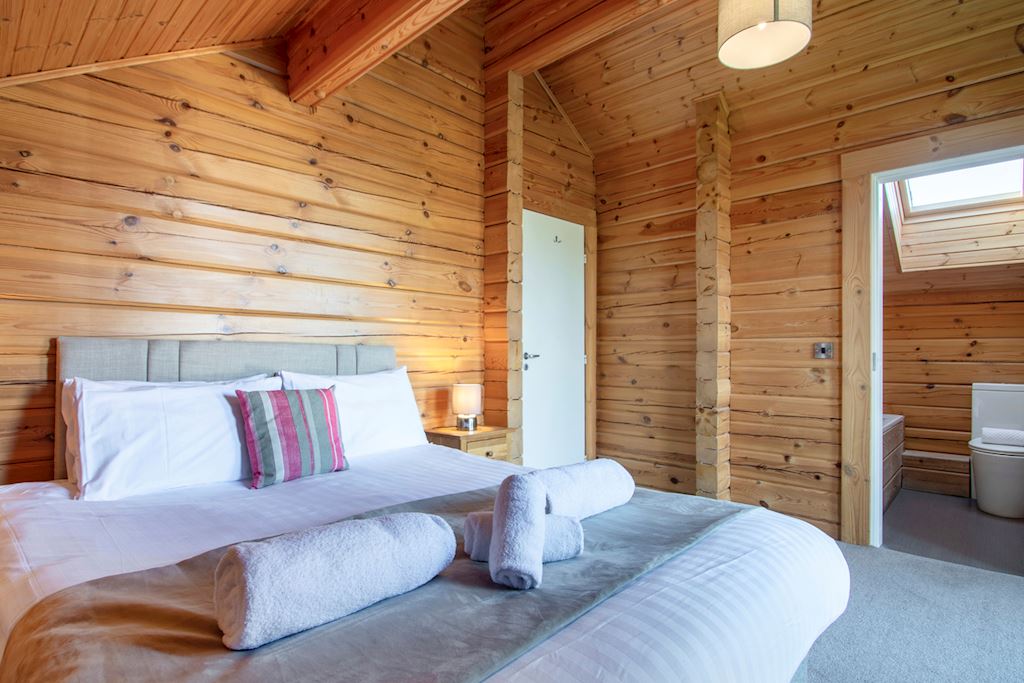 The bedroom of the Birch Spa lodges at Landal Woodland Lakes. 