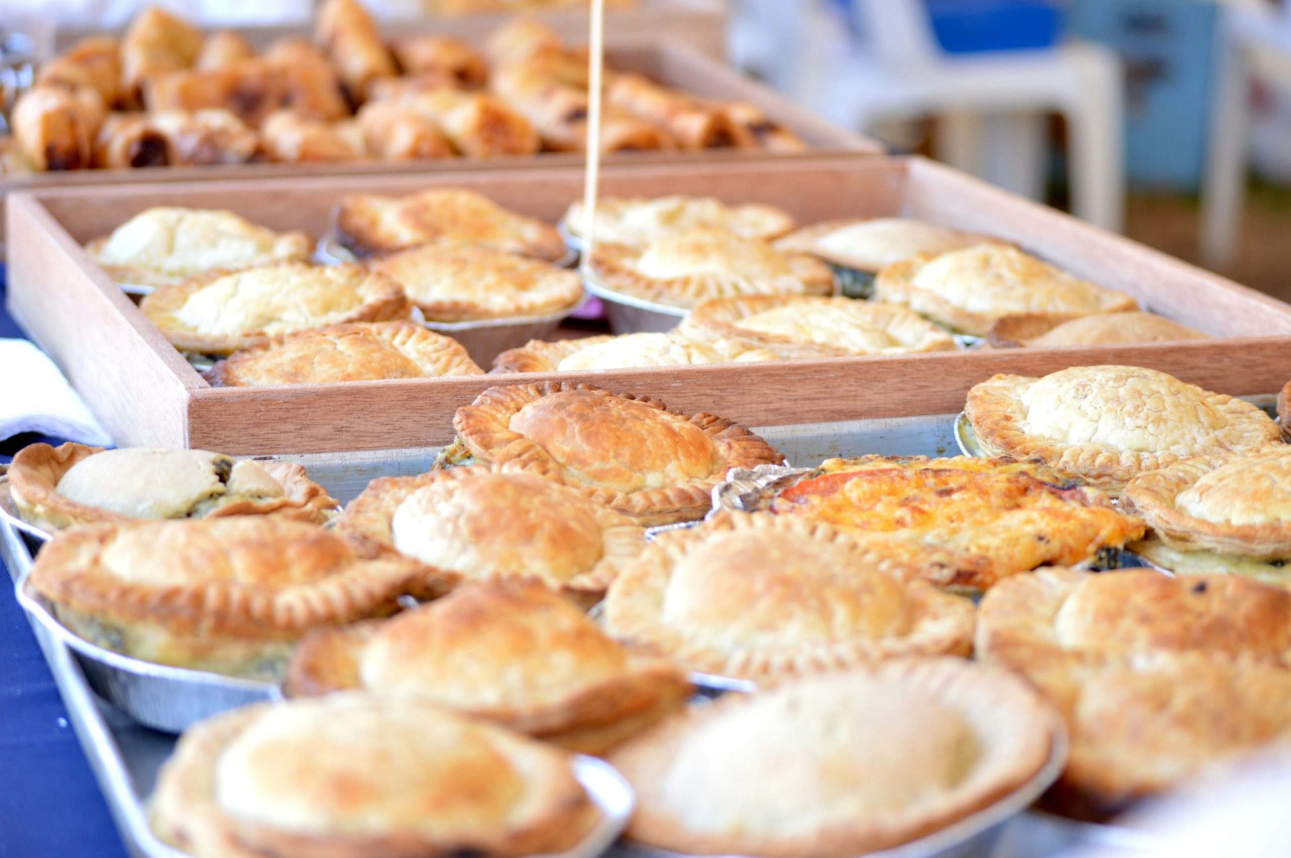 Pies on display at a market stall. 