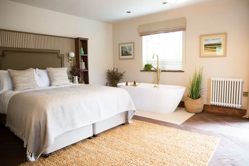 A bedroom boasting a free-standing bath at The Tempest Arms in Elslack. 