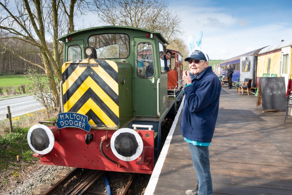 A volunteer with the Yorkshire Wolds Railway locomotive. 