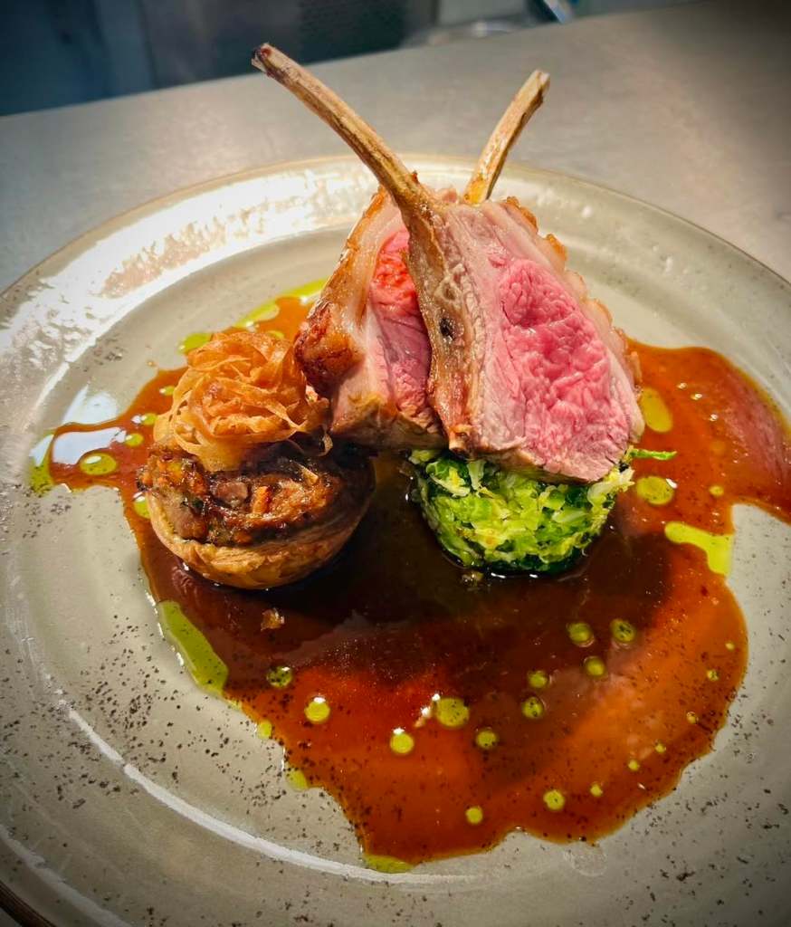 Lamb served on a plate at The Fox and Hounds Sinnington. 