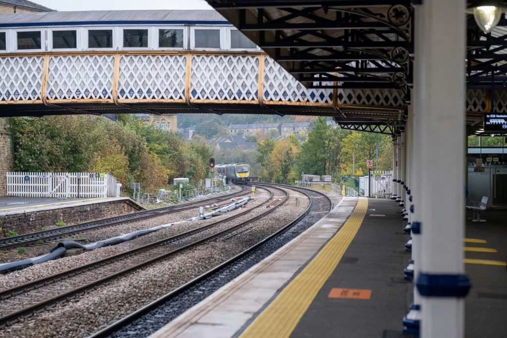 A train pulling into a British train station.