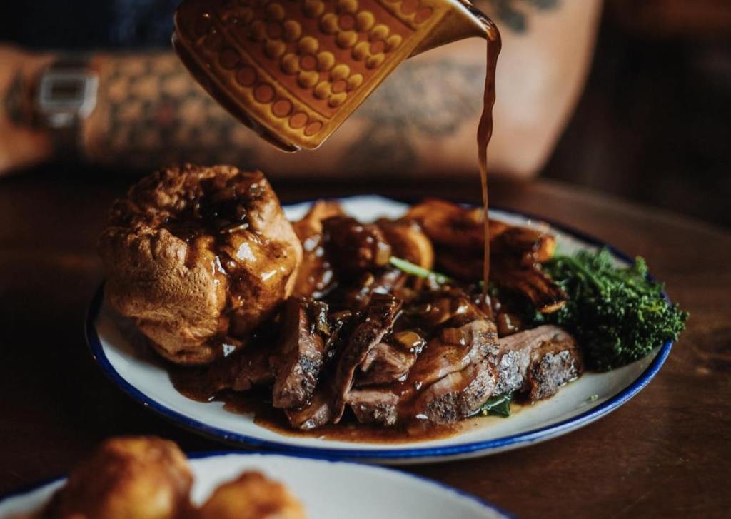 Gravy being poured over a Sunday roast at Hearth in Hull. 