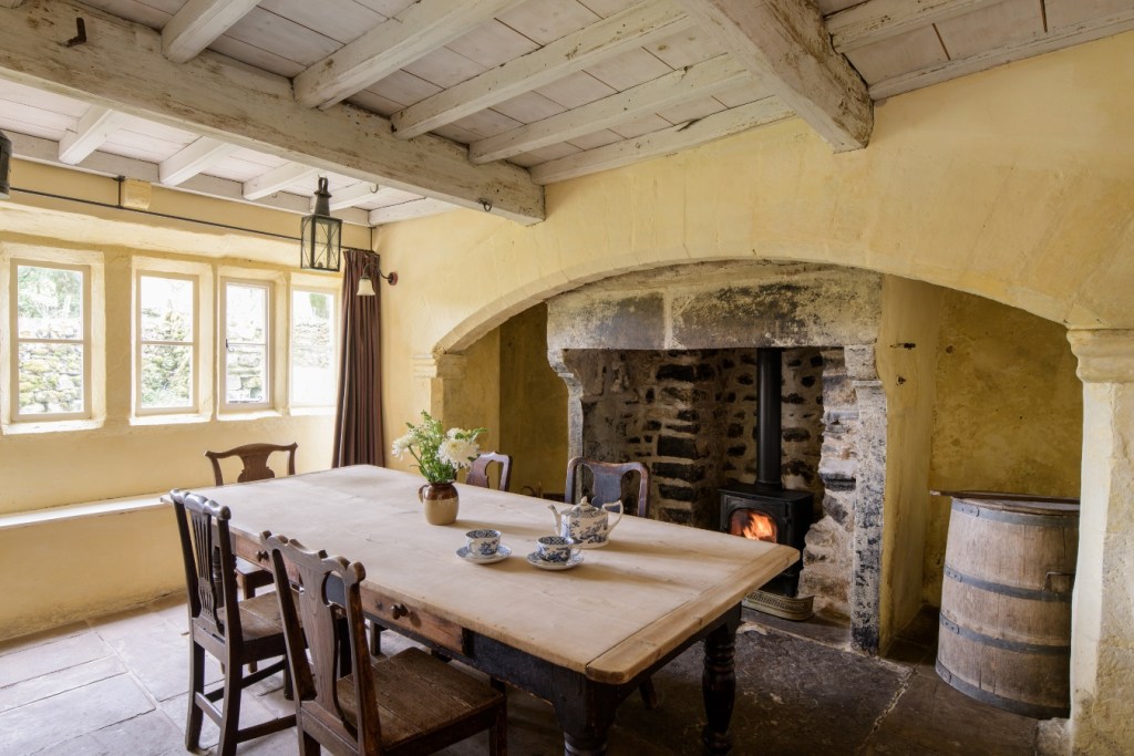 Inside the kitchen and the Inglenook fireplace at Cowside, Yorkshire Dales. 
